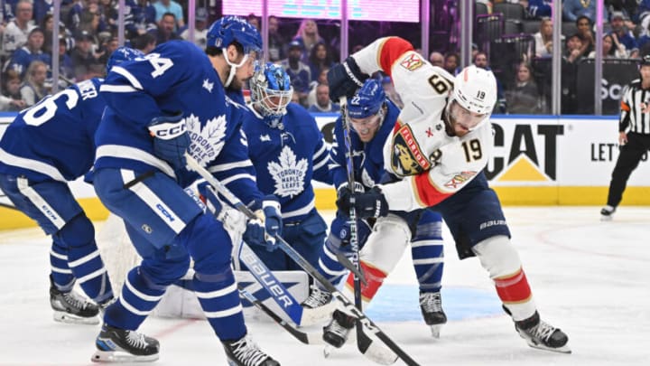 May 12, 2023; Toronto, Ontario, CAN; Florida Panthers forward Matthew Tkachuk (19) battles for a loose puck with Toronto Maple Leafs forward Auston Matthews (34) and defenseman Jake McCabe (22) in front of goalie Joseph Woll (60) in the second period in game five of the second round of the 2023 Stanley Cup Playoffs at Scotiabank Arena. Mandatory Credit: Dan Hamilton-USA TODAY Sports