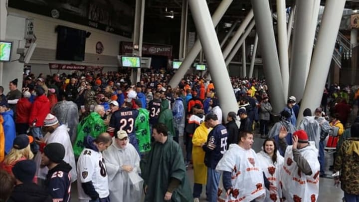 Nov 17, 2013; Chicago, IL, USA; Fans wait during a severe storm delay in the first quarter of a game between the Chicago Bears and the Baltimore Ravens at Soldier Field. Mandatory Credit: Dennis Wierzbicki-USA TODAY Sports