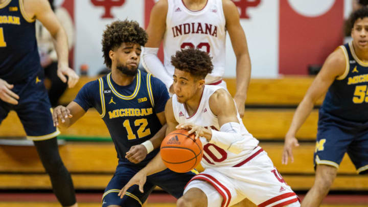 Feb 27, 2021; Bloomington, Indiana, USA; Indiana Hoosiers guard Rob Phinisee (10) dribbles the ball while Michigan Wolverines guard Mike Smith (12) defends in the second half at Simon Skjodt Assembly Hall. Mandatory Credit: Trevor Ruszkowski-USA TODAY Sports