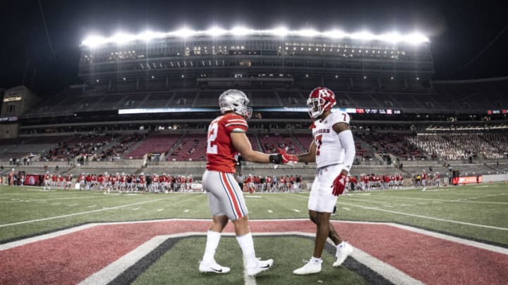 COLUMBUS, OH - NOVEMBER 7: Tuf Borland #32 of the Ohio State Buckeyes and Brendon White #7 of the Rutgers Scarlet Knights on November 7, 2020 in Columbus, Ohio. (Photo by Benjamin Solomon/Getty Images)