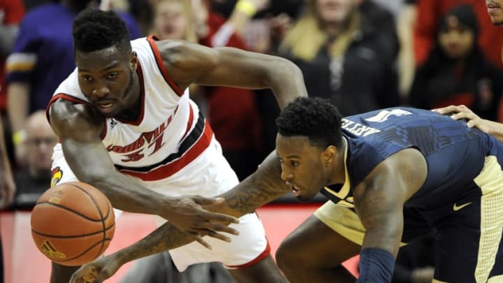 Jan 14, 2016; Louisville, KY, USA; Louisville Cardinals center Chinanu Onuaku (32) scrambles for a loose ball with Pittsburgh Panthers forward Jamel Artis (1) during the second half at KFC Yum! Center. Louisville defeated Pittsburgh 59-41. Mandatory Credit: Jamie Rhodes-USA TODAY Sports