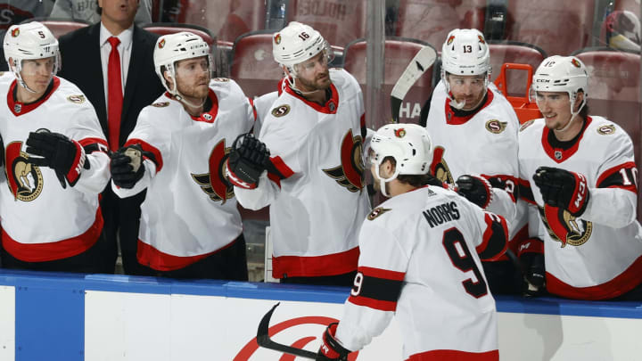 Teammates congratulate Josh Norris #9 of the Ottawa Senators (Photo by Joel Auerbach/Getty Images)