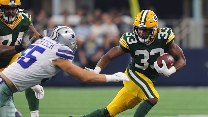 ARLINGTON, TEXAS – OCTOBER 06: Aaron Jones #33 of the Green Bay Packers rushes the ball against Leighton Vander Esch #55 of the Dallas Cowboys in the first quarter at AT&T Stadium on October 06, 2019 in Arlington, Texas. (Photo by Richard Rodriguez/Getty Images)