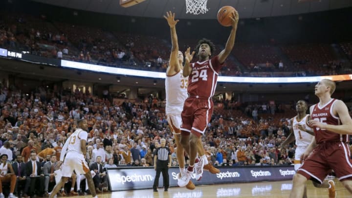 AUSTIN, TEXAS - JANUARY 08: Jamal Bieniemy #24 of the Oklahoma Sooners shoots in front of Kamaka Hepa #33 of the Texas Longhorns at The Frank Erwin Center on January 08, 2020 in Austin, Texas. (Photo by Chris Covatta/Getty Images)