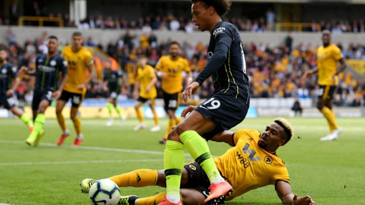 WOLVERHAMPTON, ENGLAND - AUGUST 25: Leroy Sane of Manchester City and Adama Traore of Wolverhampton Wanderers battle for the ball during the Premier League match between Wolverhampton Wanderers and Manchester City at Molineux on August 25, 2018 in Wolverhampton, United Kingdom. (Photo by Stu Forster/Getty Images)
