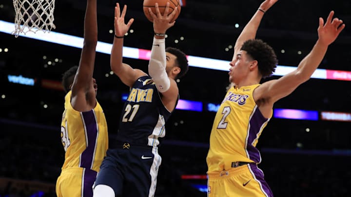 LOS ANGELES, CA - OCTOBER 02: Wilson Chandler #21 of the Denver Nuggets splits the defense of Lonzo Ball #2 and Thomas Bryant #31 of the Los Angeles Lakers during the second half of a preseason game at Staples Center on October 2, 2017 in Los Angeles, California. NOTE TO USER: User expressly acknowledges and agrees that, by downloading and or using this Photograph, user is consenting to the terms and conditions of the Getty Images License Agreement (Photo by Sean M. Haffey/Getty Images)