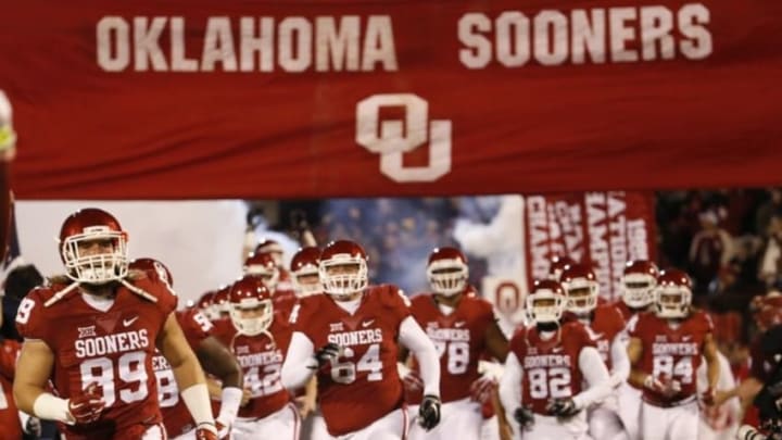 Nov 21, 2015; Norman, OK, USA; Oklahoma Sooners players run onto the field before the game against the TCU Horned Frogs at Gaylord Family - Oklahoma Memorial Stadium. Mandatory Credit: Kevin Jairaj-USA TODAY Sports