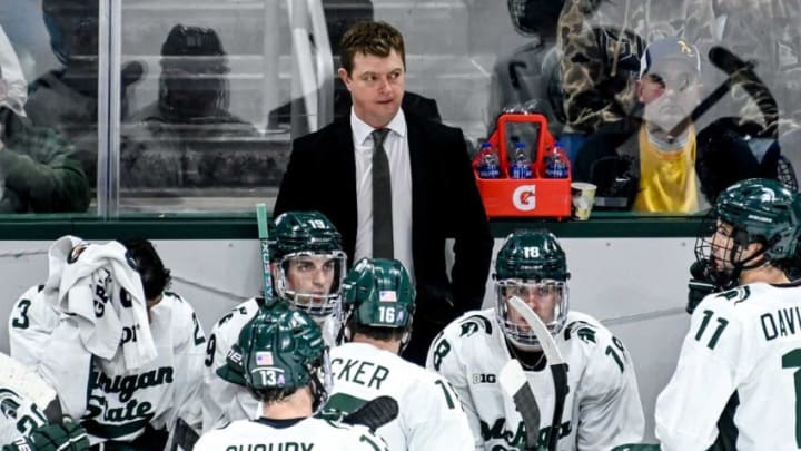 Michigan State's head coach Adam Nightingale, center, looks on during the third period in the game against Michigan on Friday, Dec. 9, 2022, at Munn Arena in East Lansing.221209 Msu Mich Hockey 125a