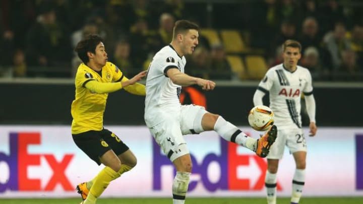 DORTMUND, GERMANY – MARCH 10: Kevin Wimmer of Tottenham Hotspur clears the ball from Shinji Kagawa of Borussia Dortmund during the UEFA Europa League Round of 16 first leg match between Borussia Dortmund and Tottenham Hotspur at Signal Iduna Park on March 10, 2016 in Dortmund, Germany. (Photo by Lars Baron/Bongarts/Getty Images)