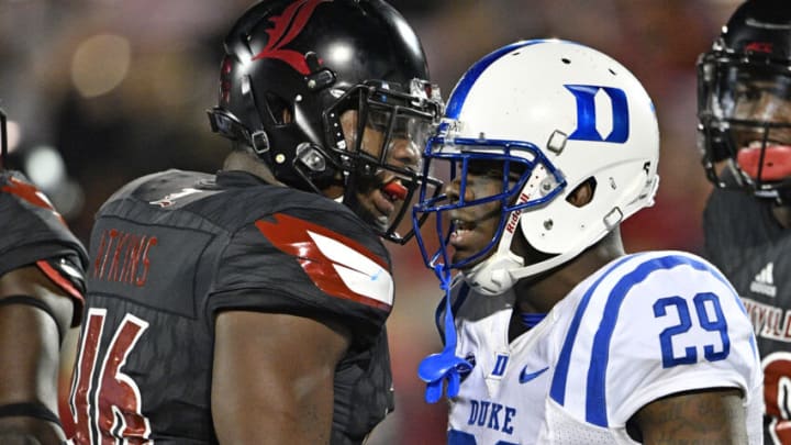 Oct 14, 2016; Louisville, KY, USA; Louisville Cardinals linebacker Lamar Atkins (46) exchanges words with Duke Blue Devils running back Shaun Wilson (29) during the second half at Papa John's Cardinal Stadium. Louisville defeated Duke 24-14. Mandatory Credit: Jamie Rhodes-USA TODAY Sports