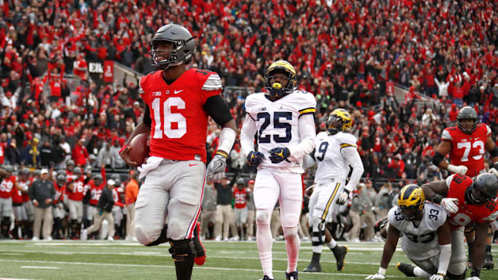 COLUMBUS, OH - NOVEMBER 26: J.T. Barrett #16 of the Ohio State Buckeyes rushes for a touchdown in overtime against the Michigan Wolverines at Ohio Stadium on November 26, 2016 in Columbus, Ohio. (Photo by Gregory Shamus/Getty Images)