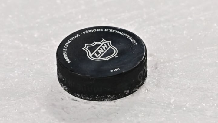 MONTREAL, QC - FEBRUARY 13: A puck sits on the ice during warmups prior to the game between the Montreal Canadiens and the Buffalo Sabres at Centre Bell on February 13, 2022 in Montreal, Canada. The Buffalo Sabres defeated the Montreal Canadiens 5-3. (Photo by Minas Panagiotakis/Getty Images)