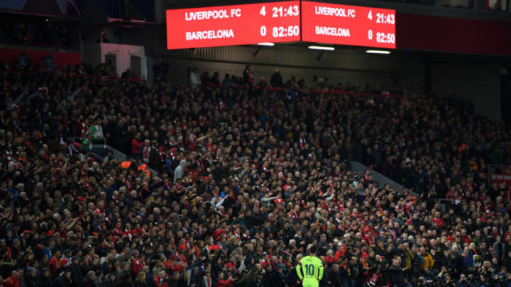 LIVERPOOL, ENGLAND - MAY 07: Lionel Messi of Barcelona looks dejected as the scoreboard reads '4-0' during the UEFA Champions League Semi Final second leg match between Liverpool and Barcelona at Anfield on May 07, 2019 in Liverpool, England. (Photo by Shaun Botterill/Getty Images)
