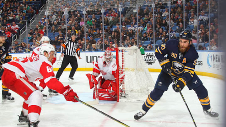 BUFFALO, NY - MARCH 29: Ryan O'Reilly #90 of the Buffalo Sabres passes the puck during an NHL game against Danny DeKeyser #65 of the Detroit Red Wings on March 29, 2018 at KeyBank Center in Buffalo, New York. (Photo by Bill Wippert/NHLI via Getty Images) *** Local Caption *** Ryan O'Reilly