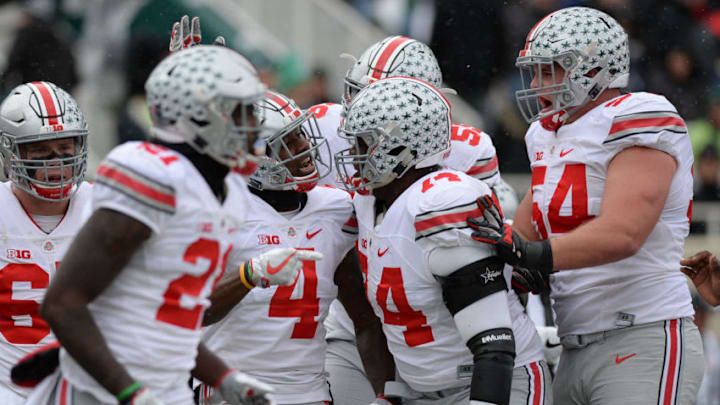 EAST LANSING, MI - NOVEMBER 19: Buckeyes running back Curtis Samuel (4) celebrates with teammates following his first quarter touchdown during a Big Ten Conference NCAA football game between Michigan State and Ohio State on November 19, 2016, at Spartan Stadium in East Lansing, MI. Ohio State defeated Michigan State 17-16. (Photo by Adam Ruff/Icon Sportswire via Getty Images)