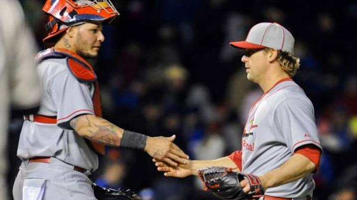 May 4, 2014; Chicago, IL, USA; St. Louis Cardinals relief pitcher Trevor Rosenthal (26) and catcher Yadier Molina (4) shake hands after beating the Chicago Cubs 5-3 at Wrigley Field. Mandatory Credit: Matt Marton-USA TODAY Sports