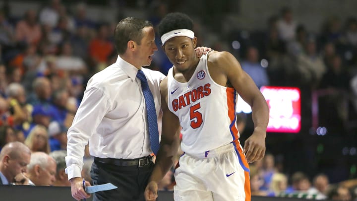 GAINESVILLE, FL – NOVEMBER 13: Head coach Mike White of the Florida Gators speaks with Allen.