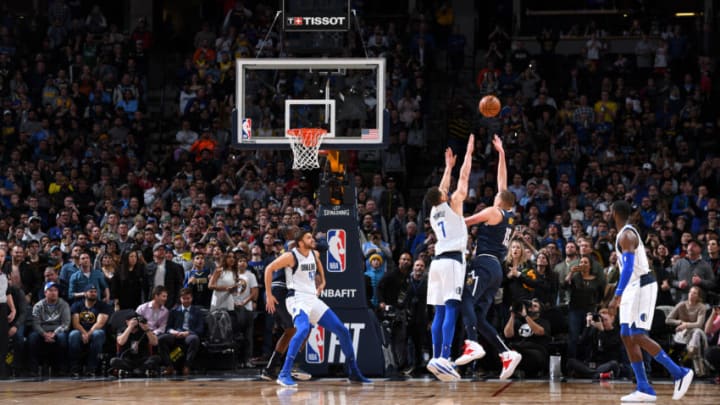 DENVER, CO - MARCH 14: Nikola Jokic #15 of the Denver Nuggets makes the game winning shot against the Dallas Mavericks on March 14, 2019 at the Pepsi Center in Denver, Colorado. NOTE TO USER: User expressly acknowledges and agrees that, by downloading and/or using this photograph, user is consenting to the terms and conditions of the Getty Images License Agreement. Mandatory Copyright Notice: Copyright 2019 NBAE (Photo by Garrett Ellwood/NBAE via Getty Images)