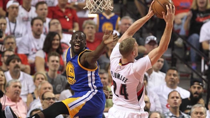 May 7, 2016; Portland, OR, USA; Golden State Warriors forward Draymond Green (23) reacts after being pushed by Portland Trail Blazers center Mason Plumlee (24) in game three of the second round of the NBA Playoffs at Moda Center at the Rose Quarter. Mandatory Credit: Jaime Valdez-USA TODAY Sports