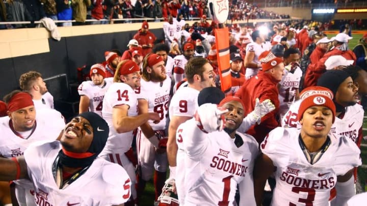 Nov 28, 2015; Stillwater, OK, USA; Oklahoma Sooners wide receivers Durron Neal (5), Jarvis Baxter (1) and wide receiver Sterling Shepard (3) celebrate in the closing seconds of the game against the Oklahoma State Cowboys at Boone Pickens Stadium. The Sooners defeated the Cowboys 58-23. Mandatory Credit: Mark J. Rebilas-USA TODAY Sports