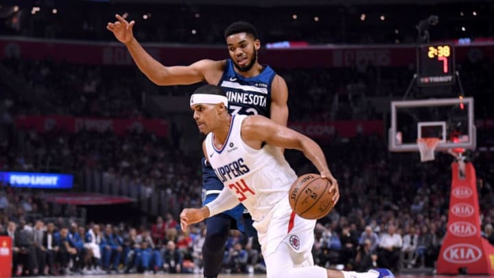 LOS ANGELES, CA - NOVEMBER 05: Tobias Harris #34 of the LA Clippers drives to the basket on Karl-Anthony Towns #32 of the Minnesota Timberwolves during the first half at Staples Center on November 5, 2018 in Los Angeles, California. (Photo by Harry How/Getty Images)