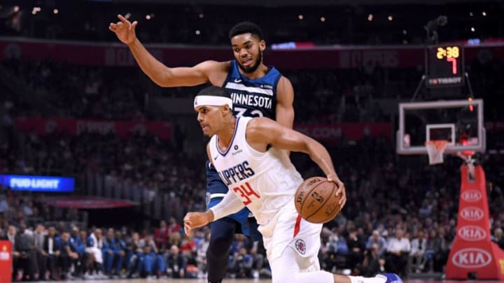 LOS ANGELES, CA - NOVEMBER 05: Tobias Harris #34 of the LA Clippers drives to the basket on Karl-Anthony Towns #32 of the Minnesota Timberwolves during the first half at Staples Center on November 5, 2018 in Los Angeles, California. (Photo by Harry How/Getty Images)