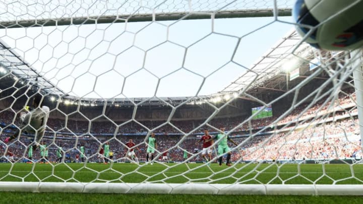 Portugal's goalkeeper Rui Patricio (L) takes the second goal by Hungary during the Euro 2016 group F football match between Hungary and Portugal at the Parc Olympique Lyonnais stadium in Decines-Charpieu, near Lyon, on June 22, 2016. / AFP / FRANCISCO LEONG (Photo credit should read FRANCISCO LEONG/AFP/Getty Images)