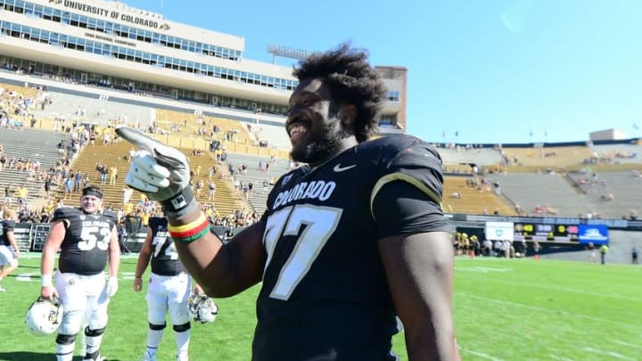 Sep 26, 2015; Boulder, CO, USA; Colorado Buffaloes offensive lineman Stephane Nembot (77) following the win over the Nicholls State Colonels at Folsom Field. The Buffaloes defeated the Colonels 48-0. Mandatory Credit: Ron Chenoy-USA TODAY Sports