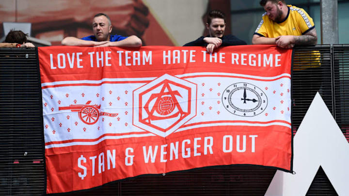 LONDON, UNITED KINGDOM - MAY 15: Supporters hold a banner to protest against owner Stan Kroenke and manager Arsene Wenger prior to the Barclays Premier League match between Arsenal and Aston Villa at Emirates Stadium on May 15, 2016 in London, England. (Photo by Mike Hewitt/Getty Images)
