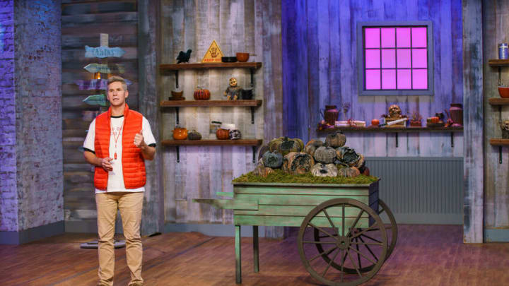Host John Henson introduces the sudden death challenge in which Guillermo Salinas and Megan Baker must make a pumpkin flavored dessert, as seen on Halloween Baking Championship, Season 7.