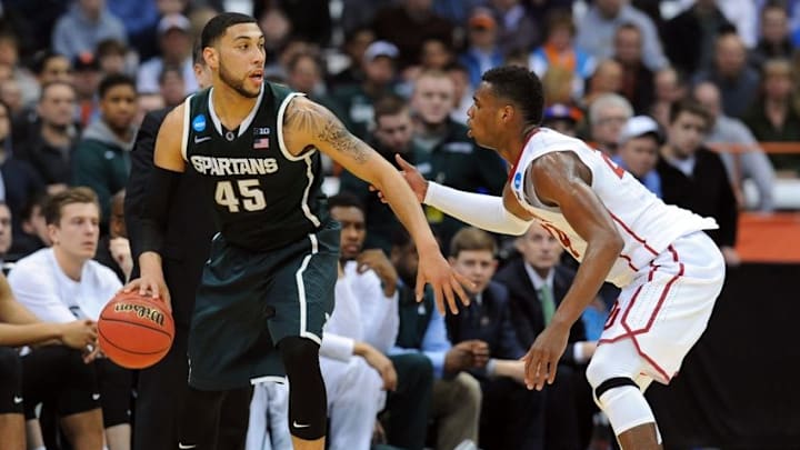 Mar 27, 2015; Syracuse, NY, USA; Michigan State Spartans guard Denzel Valentine (45) handles the ball against Oklahoma Sooners guard Buddy Hield (24) during the second half in the semifinals of the east regional of the 2015 NCAA Tournament at Carrier Dome. Mandatory Credit: Rich Barnes-USA TODAY Sports