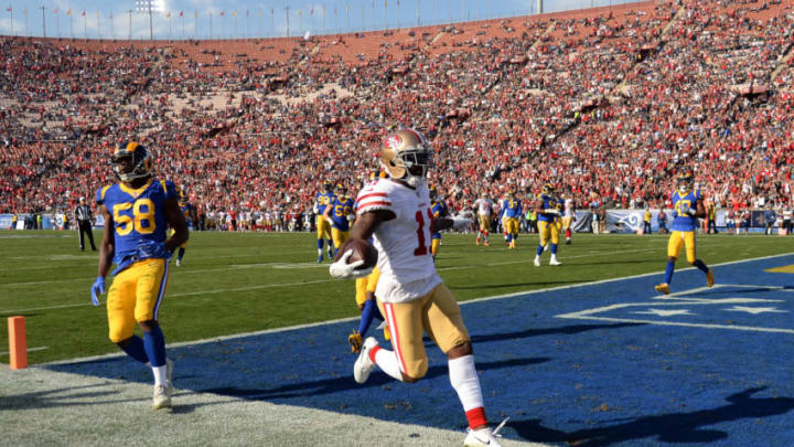 LOS ANGELES, CA - DECEMBER 31: Marquise Goodwin #11 of the San Francisco 49ers scores a touchdown during the first quarter against Brandon Allen #8 of the Los Angeles Rams at Los Angeles Memorial Coliseum on December 31, 2017 in Los Angeles, California. (Photo by Kevork Djansezian/Getty Images)
