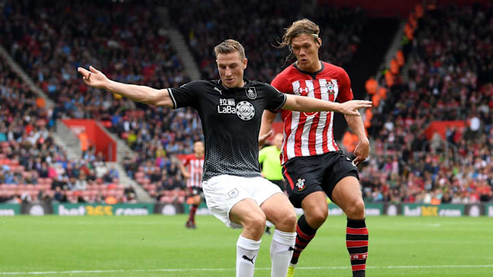 SOUTHAMPTON, ENGLAND – AUGUST 12: Chris Wood of Burnley is challenged by Jannik Vestergaard of Southampton during the Premier League match between Southampton FC and Burnley FC at St Mary’s Stadium on August 12, 2018 in Southampton, United Kingdom. (Photo by Mike Hewitt/Getty Images)