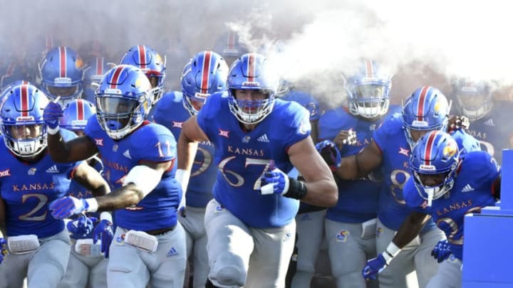 LAWRENCE, KS - SEPTEMBER 1: Members of the Kansas Jayhawks run onto the field prior to a game against the Nicholls State Colonels in the first quarter at Memorial Stadium on September 1, 2018 in Lawrence, Kansas. (Photo by Ed Zurga/Getty Images)