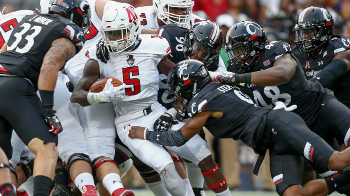 CINCINNATI, OH – AUGUST 31: Kentel Williams #5 of the Austin Peay Governors runs the ball as Linden Stephens #9 of the Cincinnati Bearcats makes the stop at Nippert Stadium on August 31, 2017 in Cincinnati, Ohio. (Photo by Michael Hickey/Getty Images)
