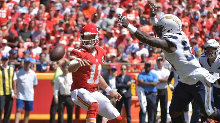 Sep 11, 2016; Kansas City, MO, USA; Kansas City Chiefs quarterback Alex Smith (11) throws a lateral as San Diego Chargers linebacker Melvin Ingram (54) defends during the first half at Arrowhead Stadium. The Chiefs won 33-27 in overtime. Mandatory Credit: Denny Medley-USA TODAY Sports