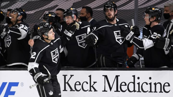 LOS ANGELES, CALIFORNIA - APRIL 23: Trevor Moore #12 of the Los Angeles Kings celebrates his goal with Dustin Brown #23 and Anze Kopitar #11, for a 1-1 tie with the Minnesota Wild, during the first period at Staples Center on April 23, 2021 in Los Angeles, California. (Photo by Harry How/Getty Images)