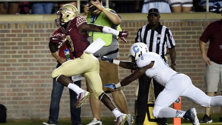 Sep 6, 2014; Tallahassee, FL, USA; Florida State Seminoles wide receiver Jesus Wilson (3) scores a touchdown past Citadel Bulldogs defensive back Cody Richardson (2) during the first quarter at Doak Campbell Stadium. Mandatory Credit: John David Mercer-USA TODAY Sports