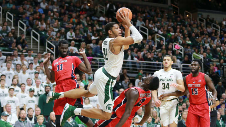 EAST LANSING, MI – NOVEMBER 19: Miles Bridges #22 of the Michigan State Spartans draws a blocking foul from Tyrell Sturdivant of the Stony Brook Seawolves at Breslin Center on November 19, 2017 in East Lansing, Michigan. (Photo by Rey Del Rio/Getty Images)