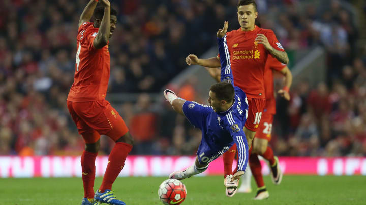 LIVERPOOL, ENGLAND – MAY 11: Eden Hazard of Chelsea takes on Kolo Toure (L) of Liverpool during the Barclays Premier League match between Liverpool and Chelsea at Anfield on May 11, 2016 in Liverpool, England. (Photo by Chris Brunskill/Getty Images)