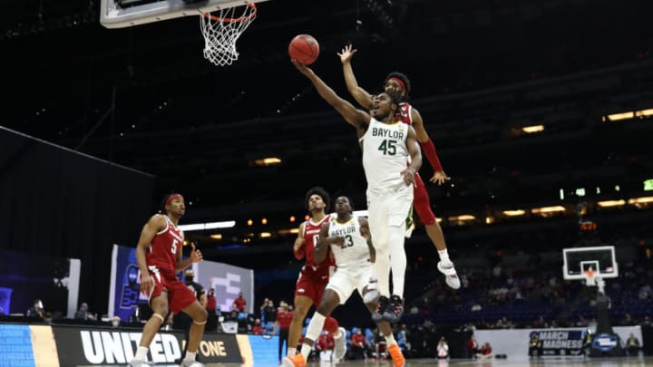 INDIANAPOLIS, INDIANA - MARCH 29: JD Notae #1 of the Arkansas Razorbacks defends against the shot by Davion Mitchell #45 of the Baylor Bears during the second half in the Elite Eight round of the 2021 NCAA Men's Basketball Tournament at Lucas Oil Stadium on March 29, 2021 in Indianapolis, Indiana. (Photo by Jamie Squire/Getty Images)