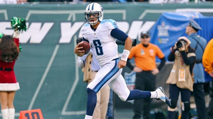 Dec 13, 2015; East Rutherford, NJ, USA; Tennessee Titans quarterback Marcus Mariota (8) catches a touchdown pass against the New York Jets during the third quarter at MetLife Stadium. The Jets defeated the Titans 30-8. Mandatory Credit: Brad Penner-USA TODAY Sports