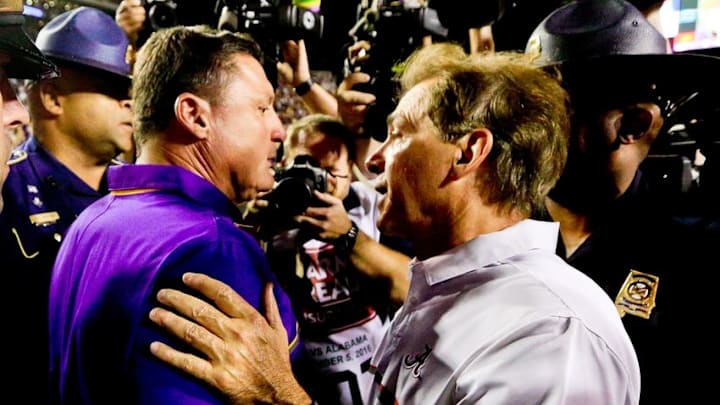 Nov 5, 2016; Baton Rouge, LA, USA; LSU Tigers head coach Ed Orgeron and Alabama Crimson Tide head coach Nick Saban talk following a game at Tiger Stadium. Alabama defeated LSU 10-0. Mandatory Credit: Derick E. Hingle-USA TODAY Sports