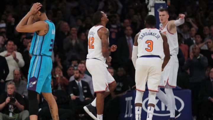 NEW YORK, NY - NOVEMBER 07: Lance Thomas #42 (L), Tim Hardaway Jr. #3, Kristaps Porzingis #6 of the New York Knicks and Jeremy Lamb #3 of the Charlotte Hornets react after the Knicks gain control of the game late in the fourth quarter during their game at Madison Square Garden on November 7, 2017 in New York City. (Photo by Abbie Parr/Getty Images)