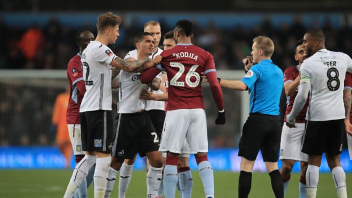 BIRMINGHAM, ENGLAND - JANUARY 05: Joe Rodon and Kyle Naughton of Swansea City argues with Jonathan Kodjia of Aston Villa during the FA Cup Third Round match between Aston Villa and Swansea City at Villa Park on January 5, 2019 in Birmingham, United Kingdom. (Photo by Marc Atkins/Getty Images)