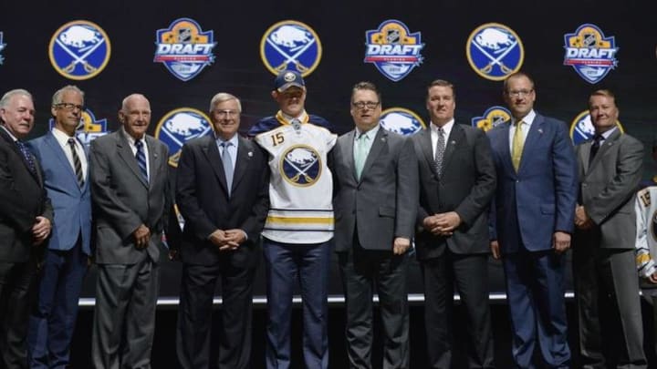 Jun 26, 2015; Sunrise, FL, USA; Jack Eichel poses with team executives after being selected as the number two overall pick to the Buffalo Sabres in the first round of the 2015 NHL Draft at BB&T Center. Mandatory Credit: Steve Mitchell-USA TODAY Sports