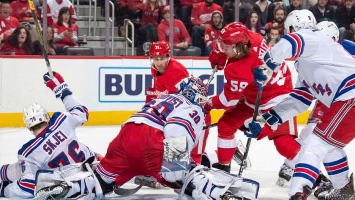 DETROIT, MI - FEBRUARY 1: Goaltender Henrik Lundqvist #30 of the New York Rangers makes a save on a shot by Tyler Bertuzzi #59 of the Detroit Red Wings as Dylan Larkin #71 of the Wings and Brady Skjei #76 of the Rangers look for the rebound during an NHL game at Little Caesars Arena on February 1, 2020 in Detroit, Michigan. (Photo by Dave Sandford/NHLI via Getty Images)