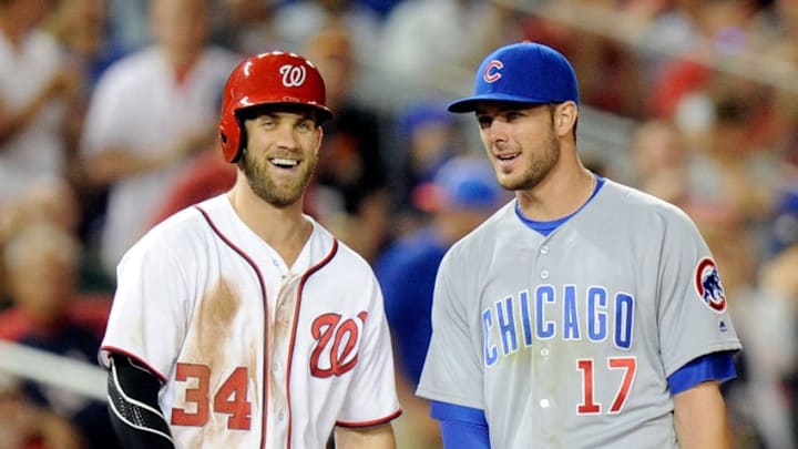 WASHINGTON, DC - JUNE 14: Bryce Harper #34 of the Washington Nationals talks with Kris Bryant #17 of the Chicago Cubs during the eighth inning at Nationals Park on June 14, 2016 in Washington, DC. Chicago won the game 4-3. (Photo by G Fiume/Getty Images)