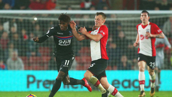 SOUTHAMPTON, ENGLAND - JANUARY 02: Wilfried Zaha of Crystal Palace is challenged by James Ward-Prowse of Southampton during the Premier League match between Southampton and Crystal Palace at St Mary's Stadium on January 2, 2018 in Southampton, England. (Photo by Charlie Crowhurst/Getty Images)