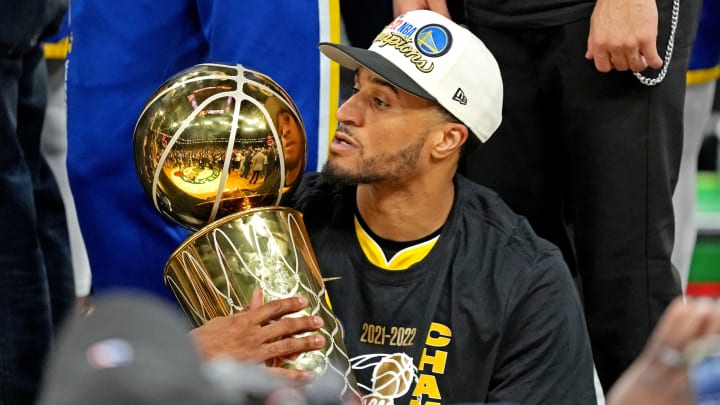 Jun 16, 2022; Boston, Massachusetts, USA; Golden State Warriors guard Gary Payton II (0) holds the the Larry O’Brien Championship Trophy after the Golden State Warriors beat the Boston Celtics in game six of the 2022 NBA Finals to win the NBA Championship at TD Garden. Mandatory Credit: Kyle Terada-USA TODAY Sports